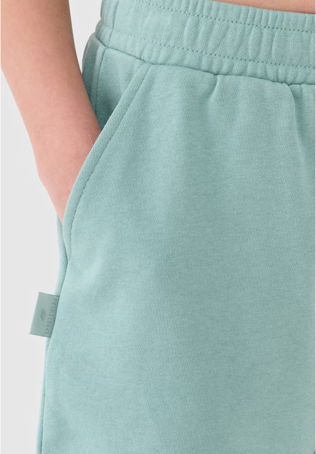 Spodenki Dresowe Dziewczęce 4F Luźne Oversize Przed Kolano Turkusowe 4FJWSS25TSHOF470